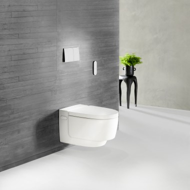 Een grijze betonwand met een grove, natuurlijke structuur geeft uw badkamer een uniek tintje. Het witte keramiek van Geberit AquaClean Mera past hier perfect bij en sluit mooi aan op deze robuuste uitstraling. Een grijze betonwand met een grove, natuurlijke structuur geeft uw badkamer een uniek tintje. Het witte keramiek van Geberit AquaClean Mera past hier perfect bij en sluit mooi aan op deze robuuste uitstraling.