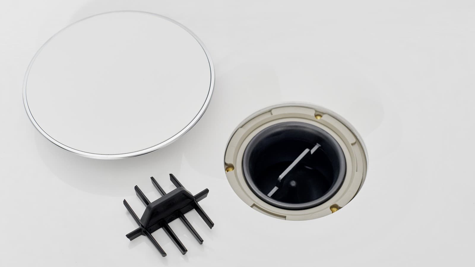 Afvoerkap met kamvormige haarzeef Afvoerkap met kamvormige haarzeef